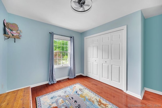 51 Olde Village Cir Unit 51, Wallingford, CT 06492 - unfurnished bedroom featuring wood finished floors and a closet