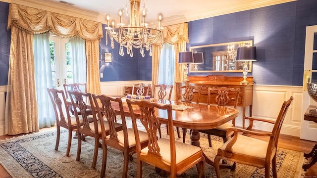 7 Taunton Ln, Newtown, CT 06470 - dining area with a decorative wall, wainscoting, a chandelier, ornamental molding, and wood finished floors
