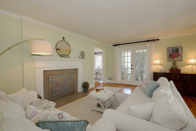 37 Giles Hill Rd, Redding, CT 06896 - living area featuring ornamental molding, wood finished floors, and a glass covered fireplace