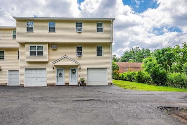 66 Atwood St Apt 16, Plainville, CT 06062 - view of front of home featuring an attached garage and asphalt driveway
