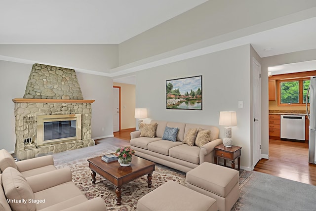 170 Scantic Meadow Rd, South Windsor, CT 06074 - living area featuring wood finished floors, high vaulted ceiling, and a fireplace