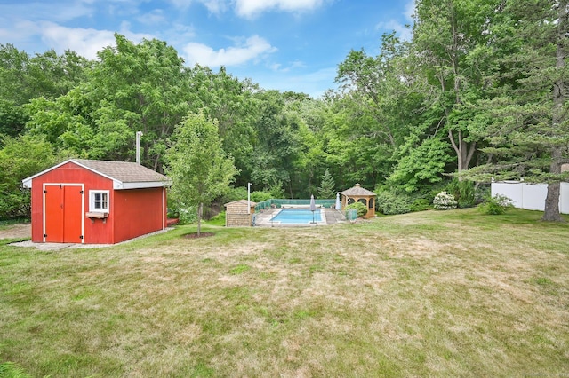 170 Scantic Meadow Rd, South Windsor, CT 06074 - view of yard featuring a gazebo, a shed, a view of trees, and an outdoor pool