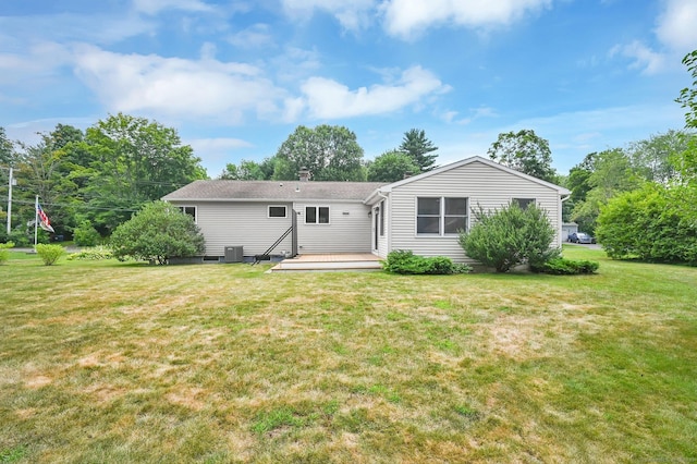 170 Scantic Meadow Rd, South Windsor, CT 06074 - rear view of house featuring a lawn, a deck, and a chimney