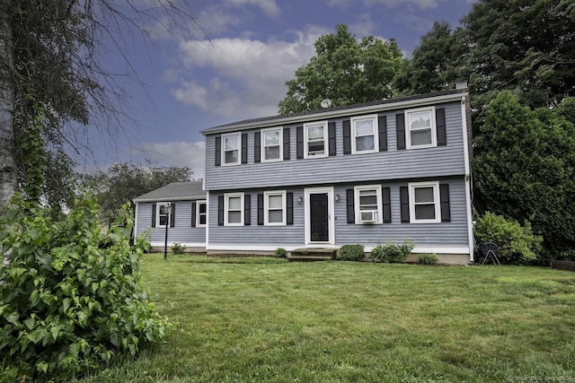 1018 Long Hill Rd, Middletown, CT 06457 - colonial-style house featuring a front yard, a chimney, and cooling unit