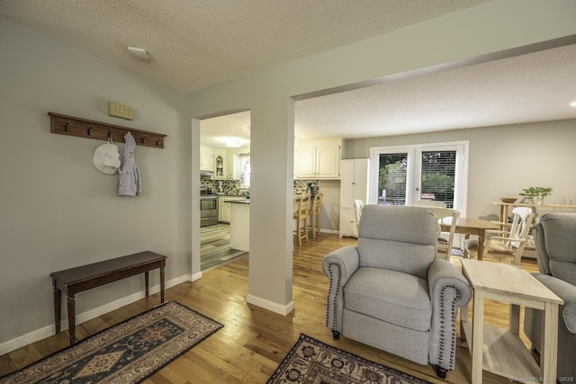 1018 Long Hill Rd, Middletown, CT 06457 - living area featuring wood finished floors and a textured ceiling