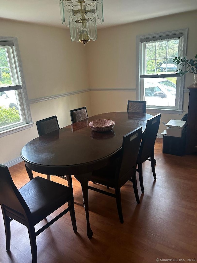 330 Dogburn Ln, Orange, CT 06477 - dining area featuring a chandelier, wood finished floors, and plenty of natural light