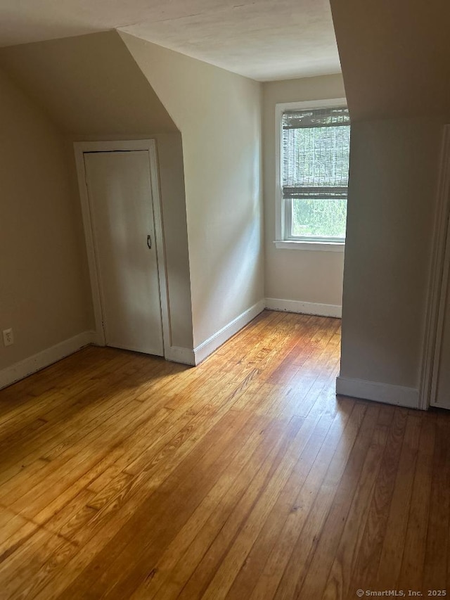 330 Dogburn Ln, Orange, CT 06477 - bonus room featuring light wood-style flooring and baseboards
