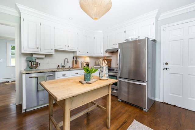 318 Milton Rd, Litchfield, CT 06759 - kitchen with stainless steel appliances, white cabinets, under cabinet range hood, crown molding, and backsplash