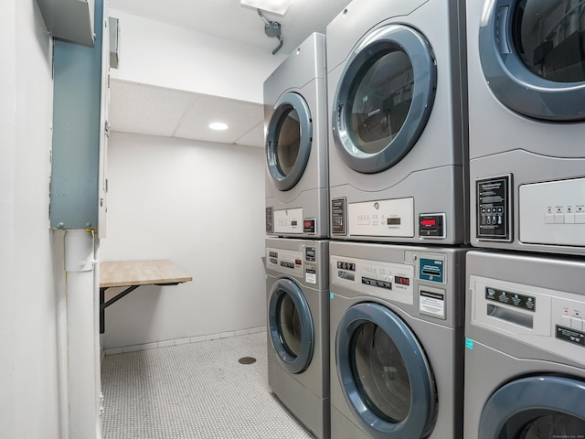 2600 Park Ave Unit 6H, Bridgeport, CT 06604 - community laundry room with stacked washing machine and dryer, recessed lighting, washer and clothes dryer, and tile patterned flooring
