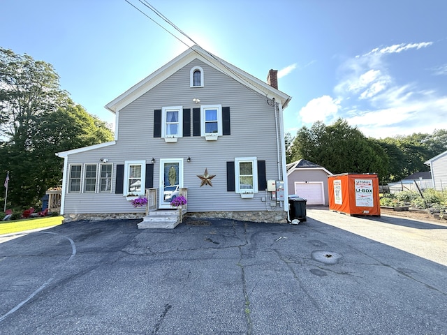 293 Torringford W St, Torrington, CT 06790 - view of front facade featuring a chimney and an outbuilding