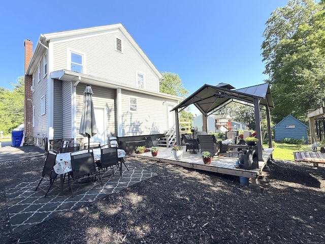 293 Torringford W St, Torrington, CT 06790 - rear view of property featuring a chimney, a deck, and outdoor dining space