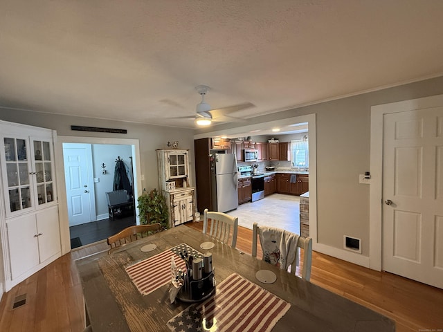 293 Torringford W St, Torrington, CT 06790 - dining area featuring light wood-style floors and ceiling fan