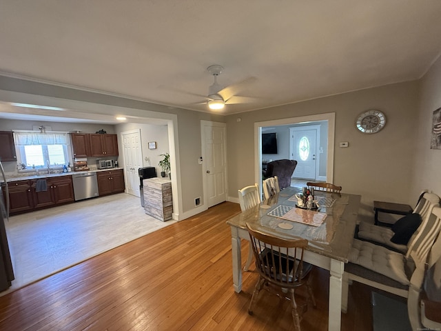 293 Torringford W St, Torrington, CT 06790 - dining room featuring light wood-style floors and ceiling fan