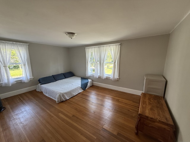 293 Torringford W St, Torrington, CT 06790 - bedroom with multiple windows and wood finished floors