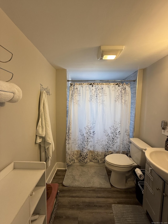 293 Torringford W St, Torrington, CT 06790 - full bathroom with vanity, wood finished floors, and curtained shower