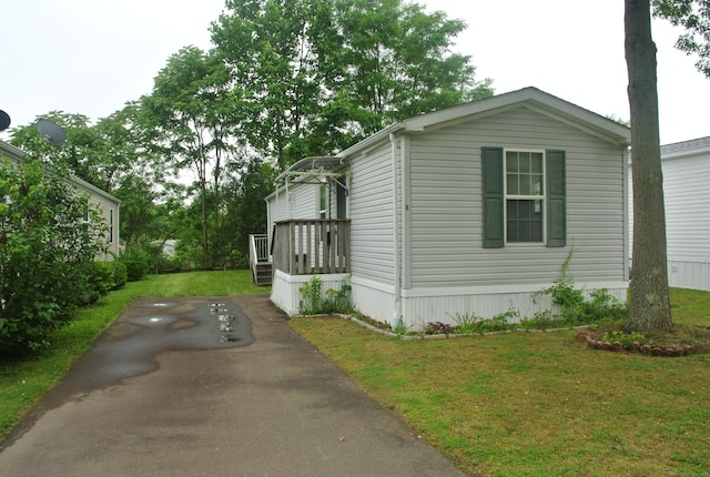8 Barn Ln, Milford, CT 06460 - view of home's exterior with driveway and a lawn