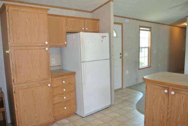 8 Barn Ln, Milford, CT 06460 - kitchen with freestanding refrigerator, crown molding, light flooring, plenty of natural light, and light countertops