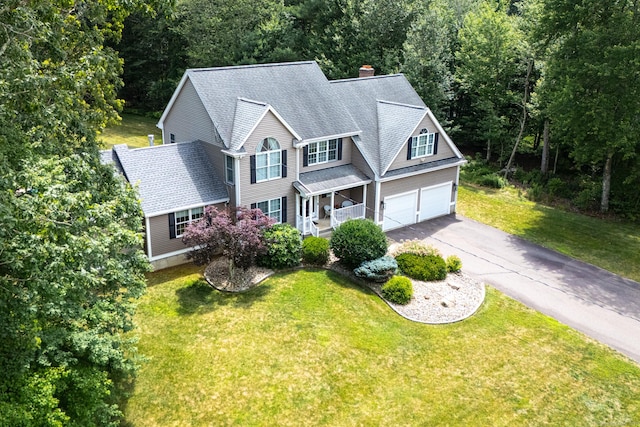 132 Deerwood Rd, Tolland, CT 06084 - view of front of property featuring a garage, driveway, and a front lawn