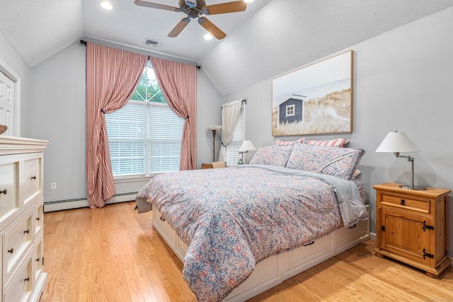 132 Deerwood Rd, Tolland, CT 06084 - bedroom featuring baseboard heating, lofted ceiling, light wood-style flooring, a ceiling fan, and recessed lighting