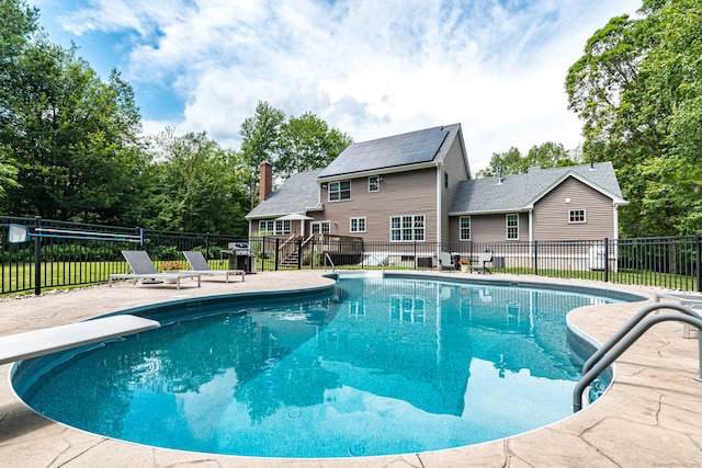 132 Deerwood Rd, Tolland, CT 06084 - view of swimming pool with a patio area, a deck, stairs, and a diving board