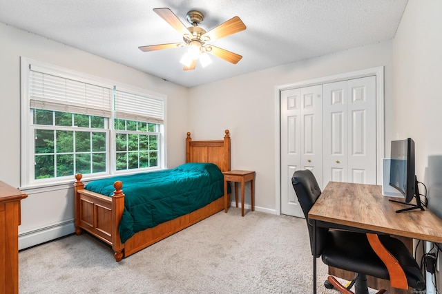132 Deerwood Rd, Tolland, CT 06084 - bedroom featuring a baseboard heating unit, a closet, light carpet, a desk, and ceiling fan