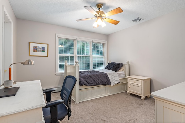 132 Deerwood Rd, Tolland, CT 06084 - bedroom with light carpet, an office area, ceiling fan, and a textured ceiling