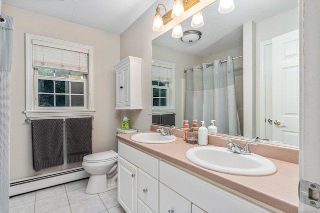 132 Deerwood Rd, Tolland, CT 06084 - bathroom featuring baseboard heating, double vanity, tile patterned floors, and a shower with shower curtain