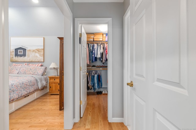 132 Deerwood Rd, Tolland, CT 06084 - bedroom featuring a walk in closet and light wood-style floors