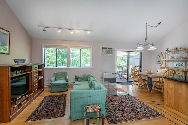 109 Old Farms Rd Unit 109, Torrington, CT 06790 - living area featuring track lighting, a wall unit AC, vaulted ceiling, light wood-style flooring, and a baseboard heating unit