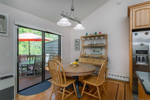 109 Old Farms Rd Unit 109, Torrington, CT 06790 - dining space with lofted ceiling, a baseboard radiator, light wood-style flooring, and heating unit