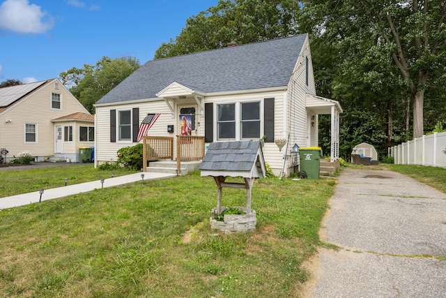 170 Celia Dr, Waterbury, CT 06705 - new england style home with roof with shingles, driveway, and a chimney