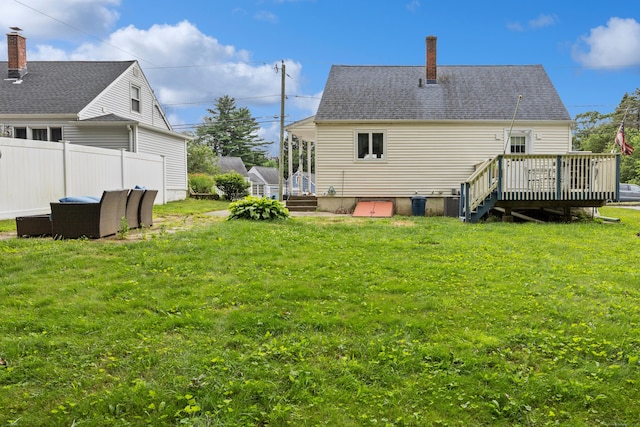 170 Celia Dr, Waterbury, CT 06705 - back of house with a wooden deck and a chimney