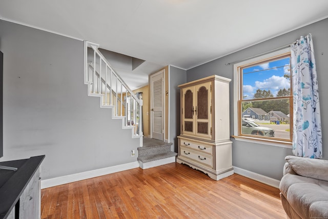 170 Celia Dr, Waterbury, CT 06705 - living area featuring light wood-style floors, stairs, and plenty of natural light