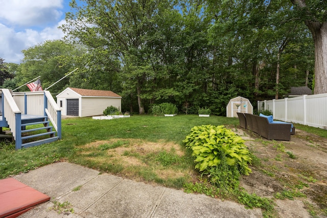 170 Celia Dr, Waterbury, CT 06705 - view of yard featuring a storage unit, a wooden deck, and view of wooded area
