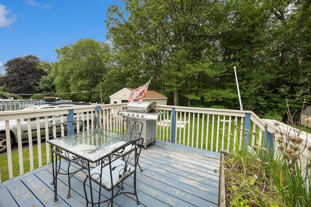 170 Celia Dr, Waterbury, CT 06705 - wooden terrace featuring a grill, outdoor dining area, a yard, and view of wooded area