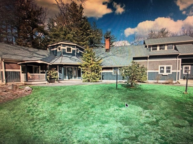 1 Alcima Dr, Simsbury, CT 06070 - rear view of house with a lawn, a chimney, and a porch