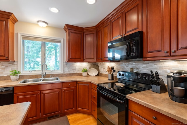 54 Round Hill Rd, Manchester, CT 06040 - kitchen featuring black appliances, backsplash, light countertops, and recessed lighting