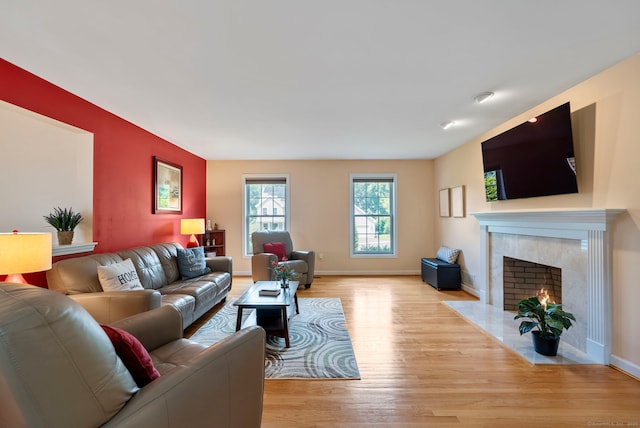 54 Round Hill Rd, Manchester, CT 06040 - living room with light wood-style flooring and a fireplace