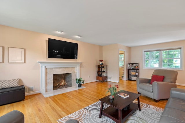 54 Round Hill Rd, Manchester, CT 06040 - living area featuring wood finished floors and a tile fireplace