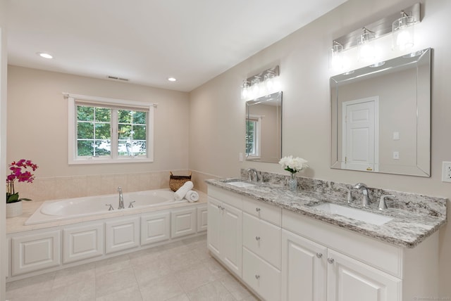 54 Round Hill Rd, Manchester, CT 06040 - bathroom with double vanity, a garden tub, recessed lighting, and tile patterned floors