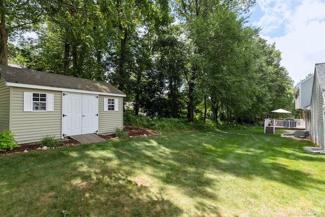 54 Round Hill Rd, Manchester, CT 06040 - view of green lawn featuring a deck and an outdoor structure