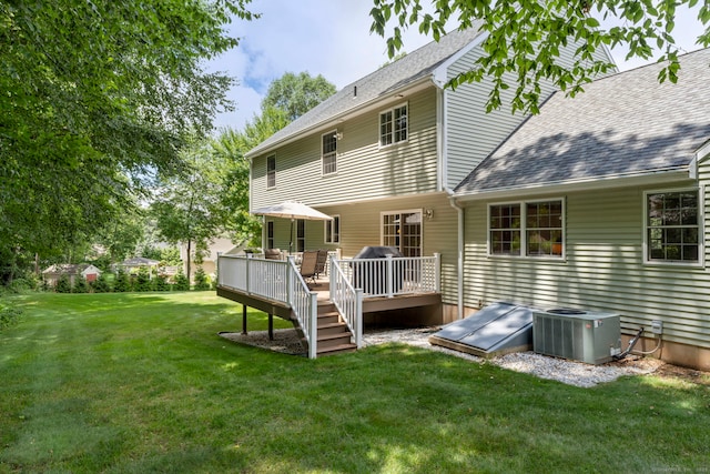 54 Round Hill Rd, Manchester, CT 06040 - rear view of house with a deck, a lawn, and roof with shingles