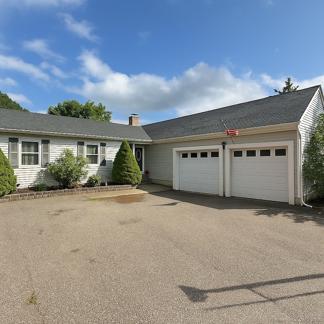 50 Mohegan Dr, Griswold, CT 06351 - ranch-style home with a garage, asphalt driveway, and a chimney