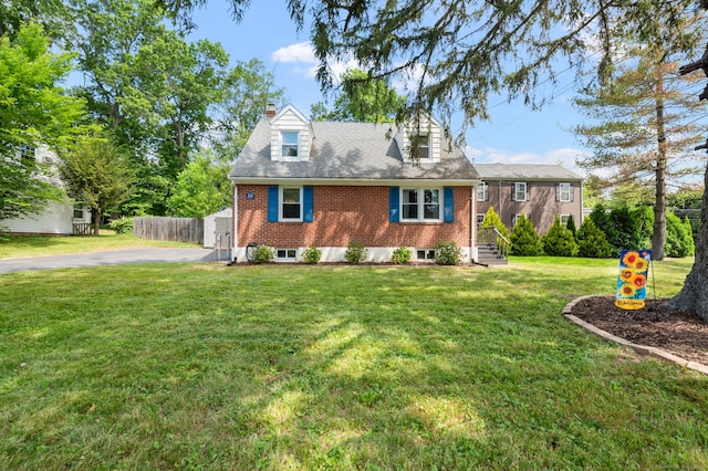 10 Harding Ave, Newington, CT 06111 - cape cod-style house featuring brick siding, a chimney, and driveway
