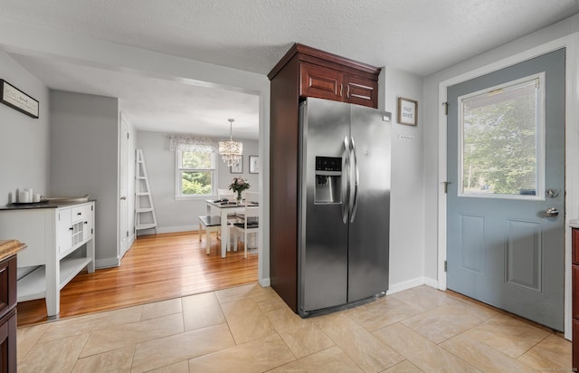 10 Harding Ave, Newington, CT 06111 - kitchen featuring stainless steel fridge, a chandelier, and light tile patterned floors