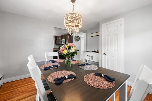 10 Harding Ave, Newington, CT 06111 - dining room with a chandelier and light wood finished floors