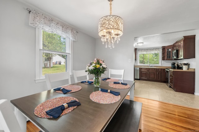 10 Harding Ave, Newington, CT 06111 - dining room with a chandelier and light wood finished floors