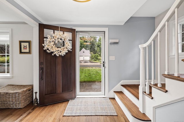 66 Concord St, West Hartford, CT 06119 - entrance foyer featuring stairs, light wood-type flooring, and ornamental molding