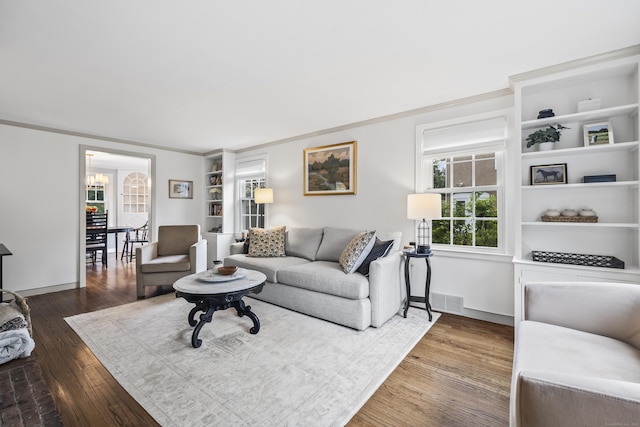 66 Concord St, West Hartford, CT 06119 - living area with crown molding, dark wood-type flooring, and plenty of natural light