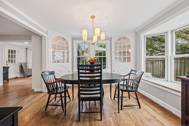 66 Concord St, West Hartford, CT 06119 - dining room with crown molding, wood finished floors, and a chandelier